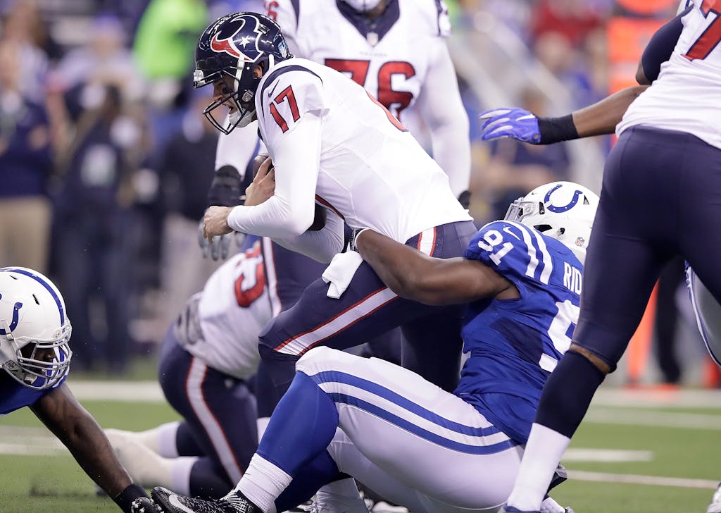INDIANAPOLIS, IN - DECEMBER 11: Brock Osweiler #17 of the Houston Texans is sacked by Hassan Ridgeway #91 of the Indianapolis Colts during the first quarter of the game at Lucas Oil Stadium on December 11, 2016 in Indianapolis, Indiana. (Photo by Andy Lyons/Getty Images)