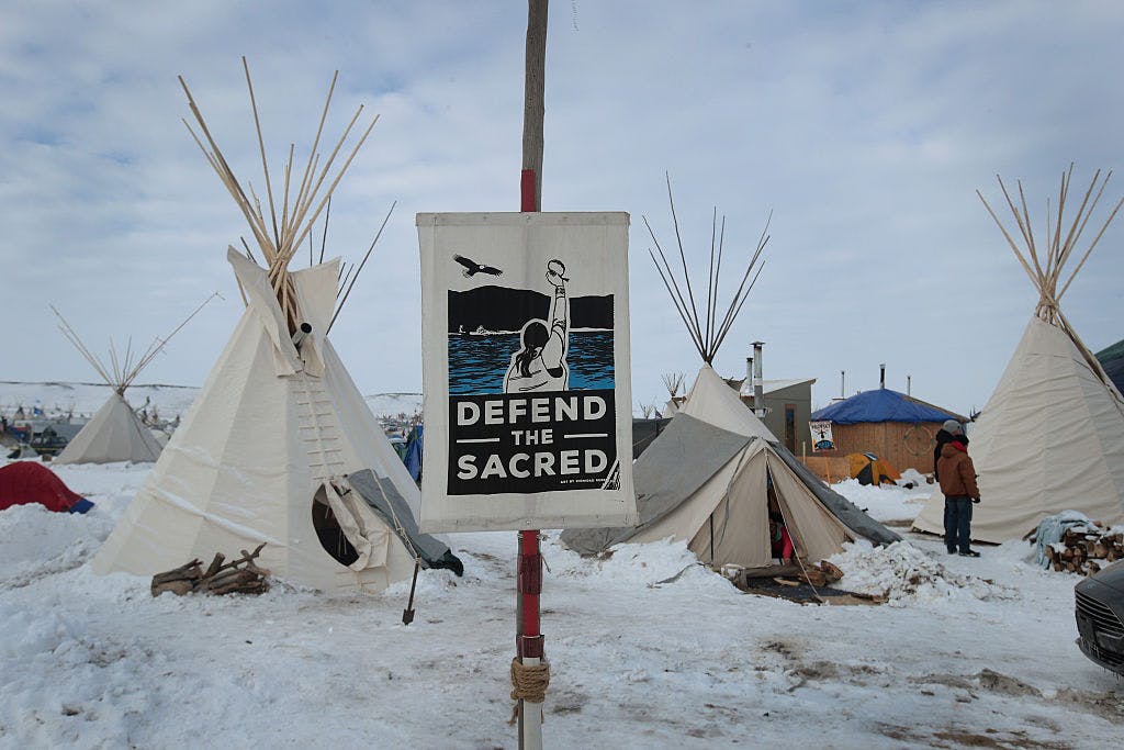 Snow covers the ground at Oceti Sakowin Camp on the edge of the Standing Rock Sioux Reservation on December 2, 2016 outside Cannon Ball, North Dakota. Native Americans and activists from around the country have been gathering at the camp for several months trying to halt the construction of the Dakota Access Pipeline.