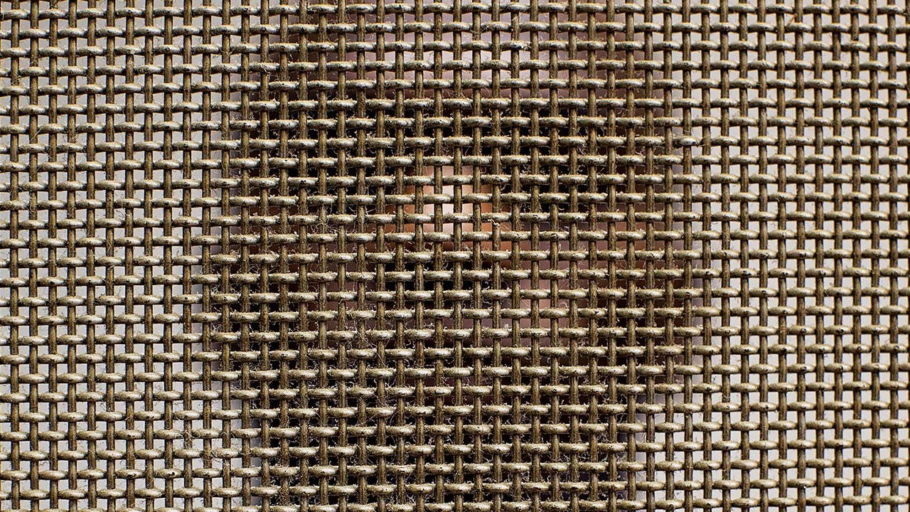 Debrow photographed through a grate in prison. 