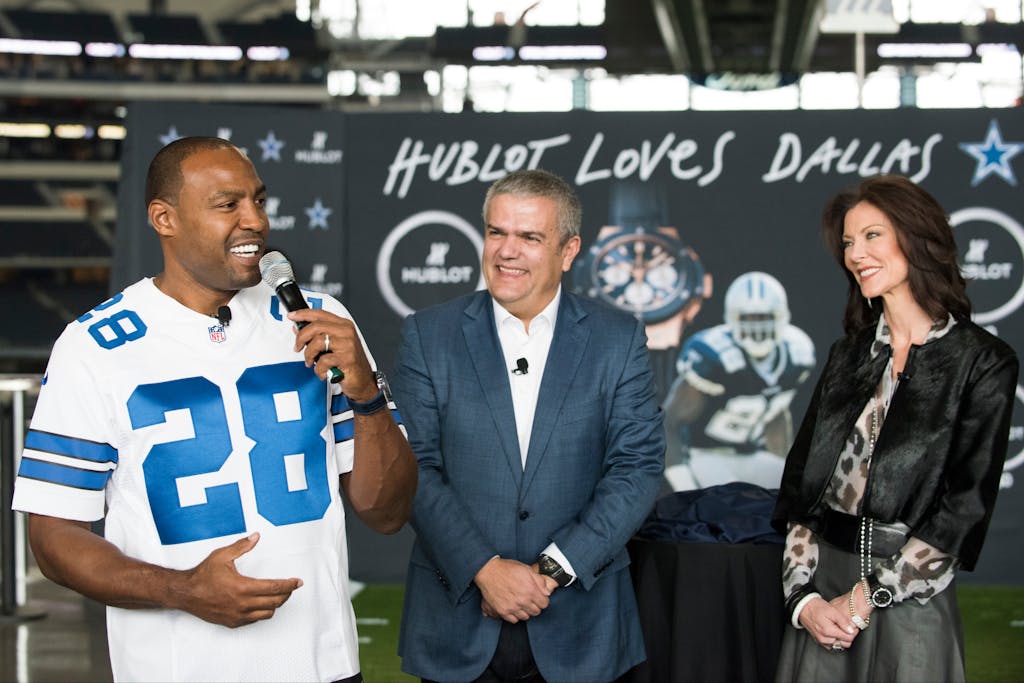Darren Woodson, Ricardo Guadalupe, and Charlotte Jones Anderson unveil the Hublot Big Bang Dallas Cowboys timepieces at AT&T Stadium in November 2015. (Photo by Cooper Neill/Getty Images for Hublot)