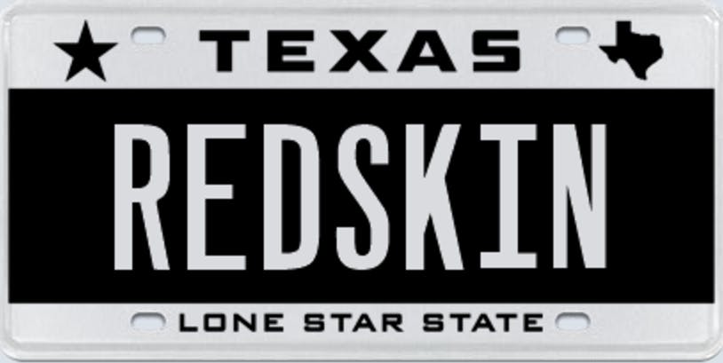 Texas license plate that says "redskin."
