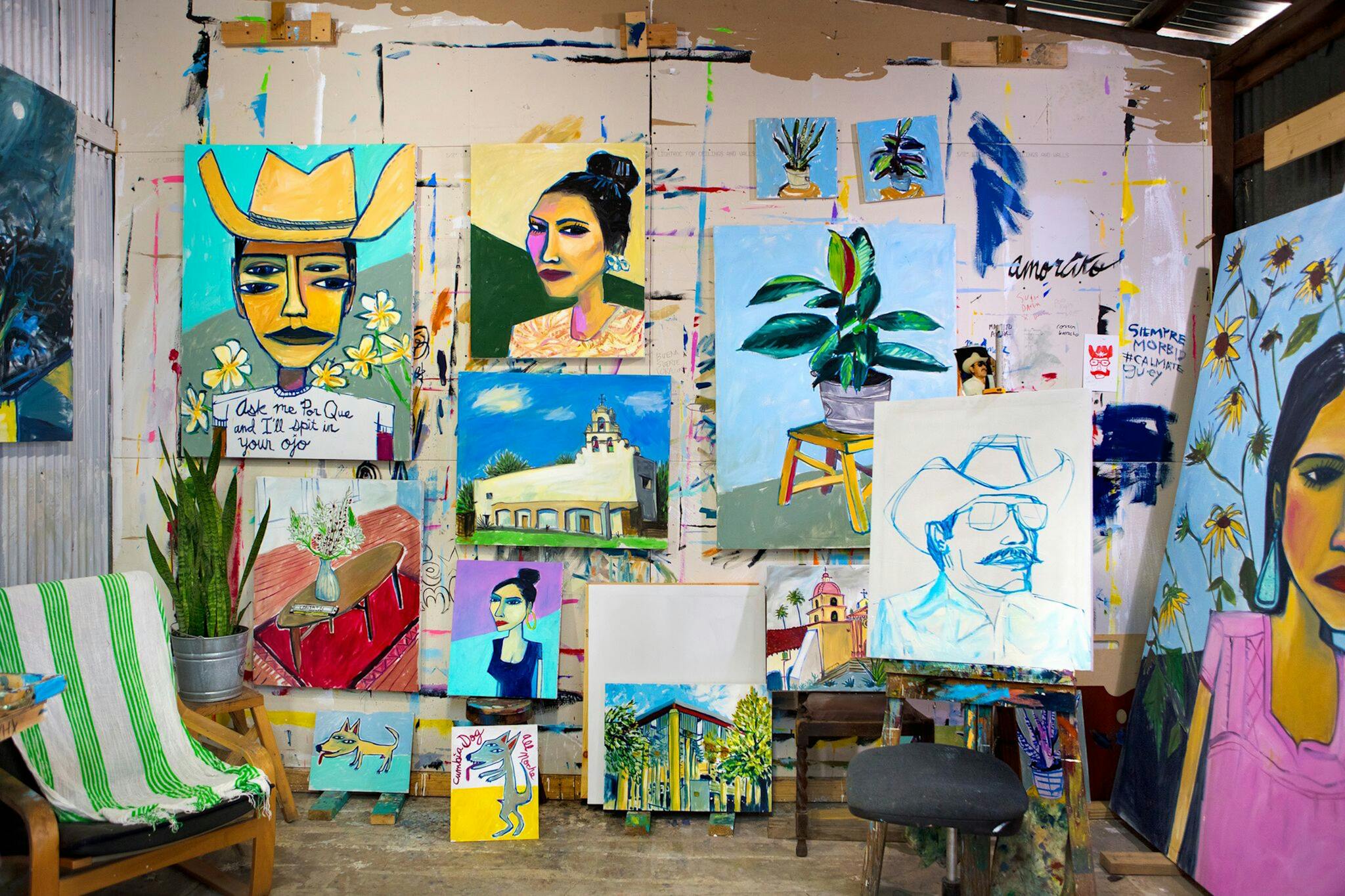 Cruz Ortiz's studio full of vibrant portraits and paintings.