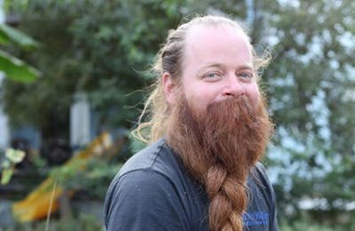 Whisker Wars star Bryan Nelson with his beard in a standard three strand braid. 