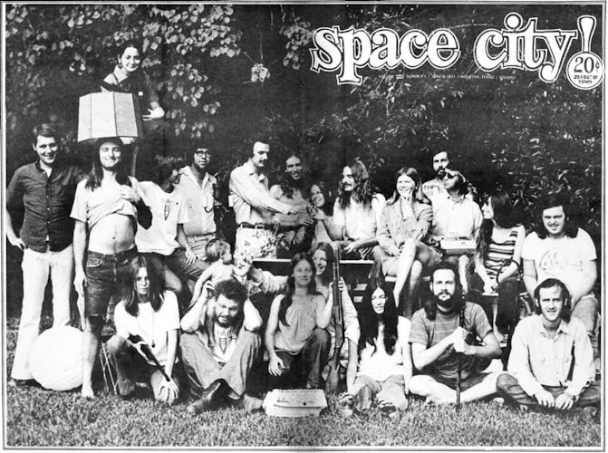 Space City! staff poses for a black and white photo. 