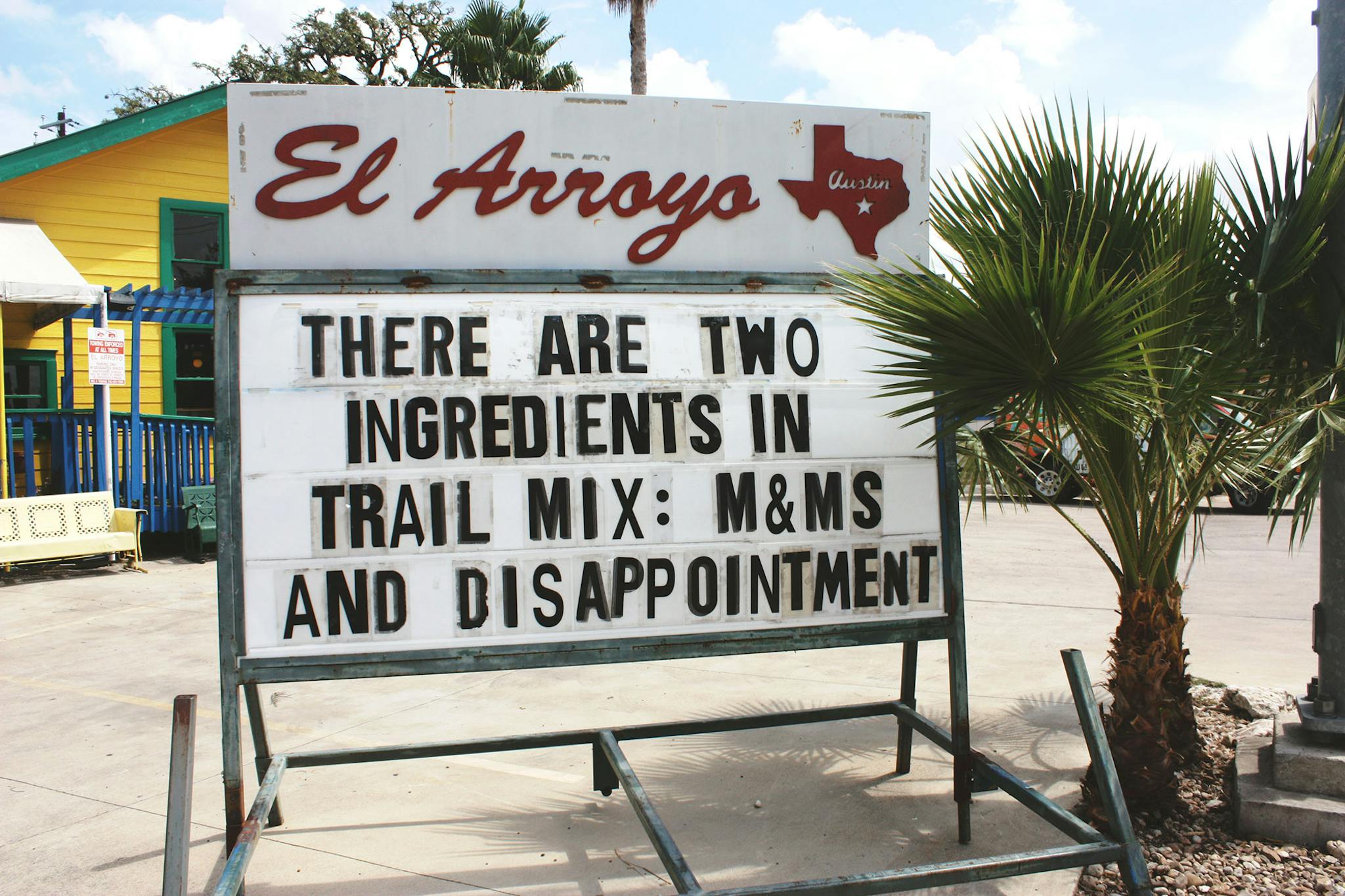 El Arroyo sign says there are two ingredients in trail mix: m&ms and disappointment.