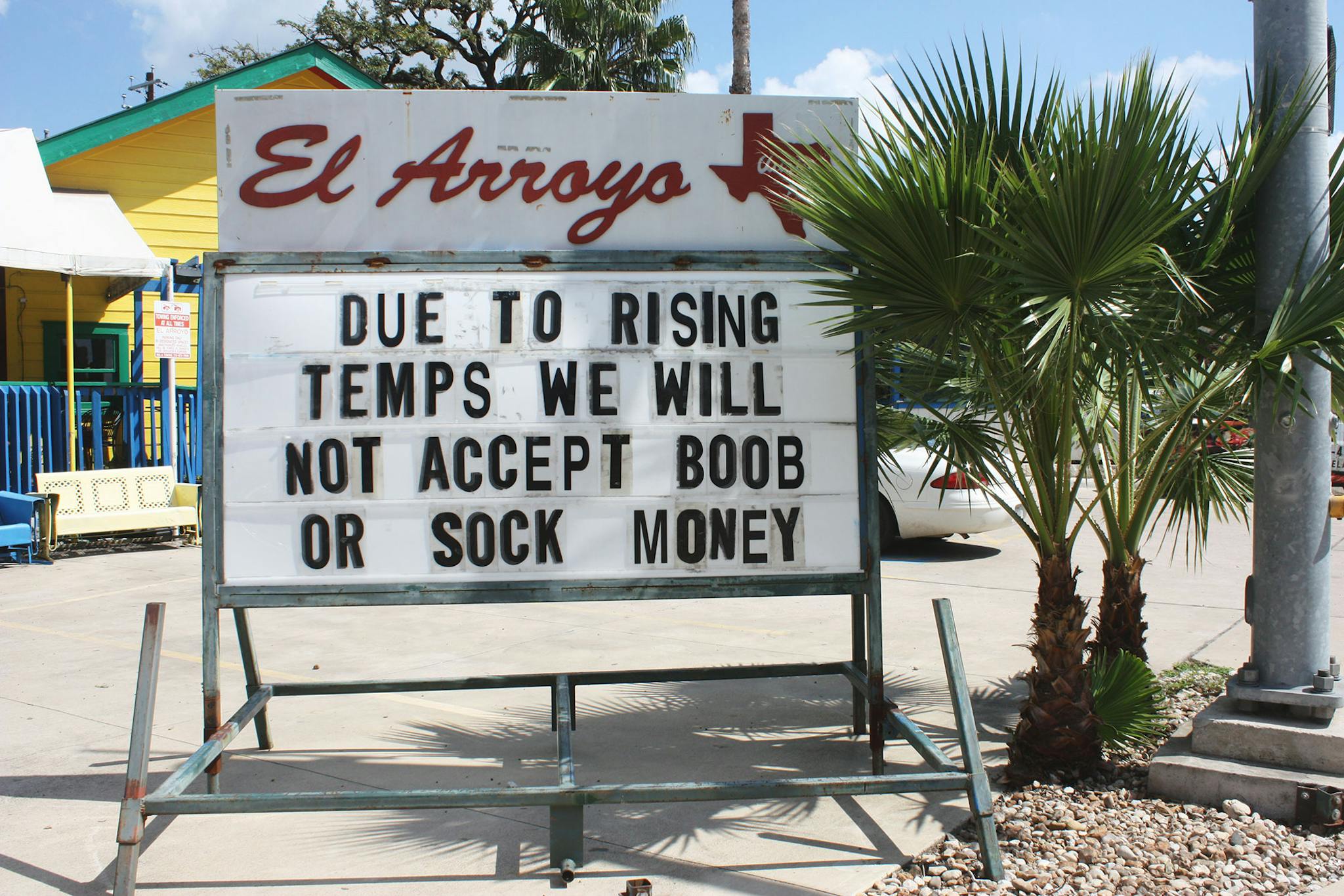 El Arroyo sign says due to rising temps we will not accept boob or sock money.