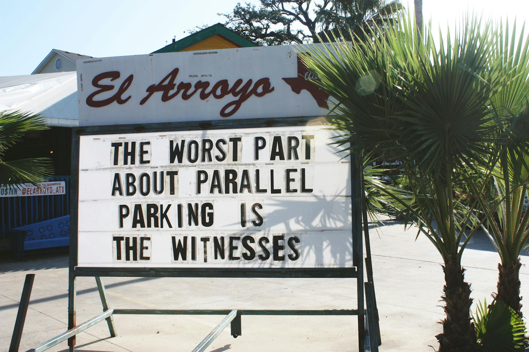 El Arroyo sign says the worst part about parallel parking is the witnesses.
