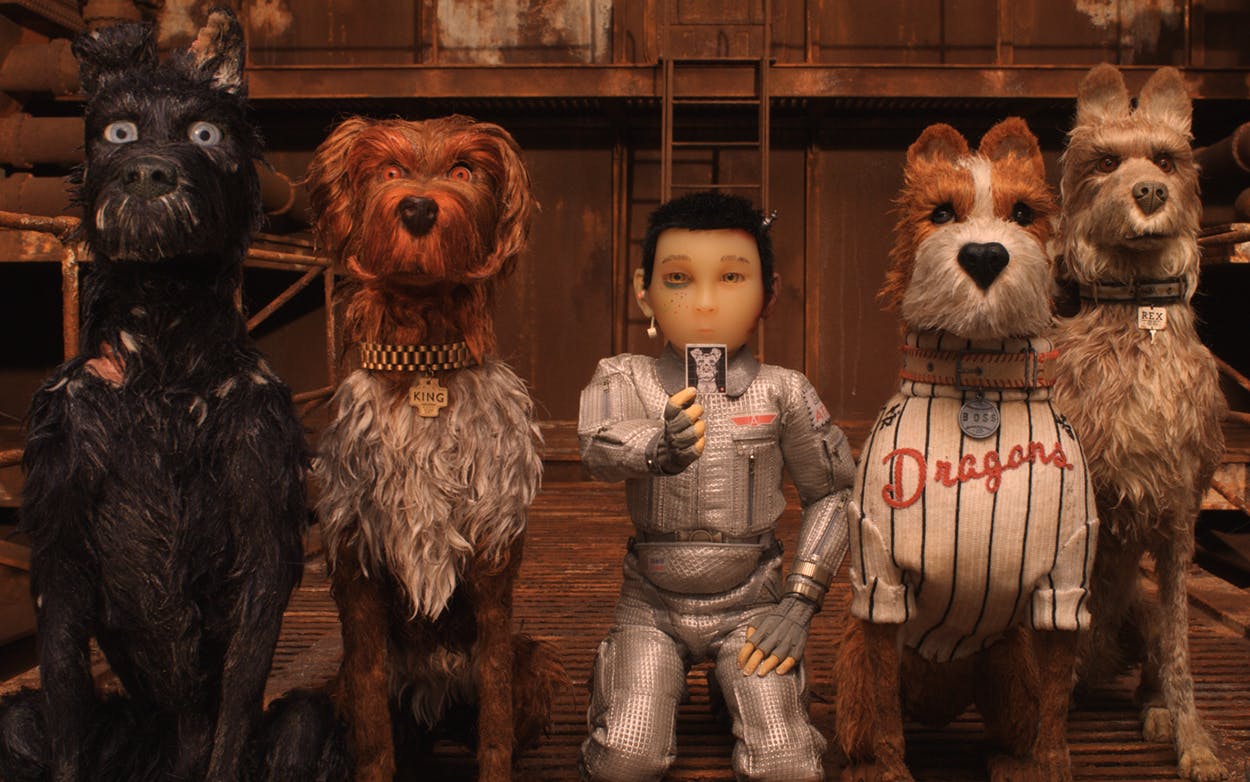 Atari, a character voiced by Koyu Rankin, is flanked by canine characters Chief (Bryan Cranston) and King (Bob Balaban) on the left and Boss (Bill Murray) and Rex (Edward Norton) on the right in Wes Anderson’s “Isle of Dogs.”