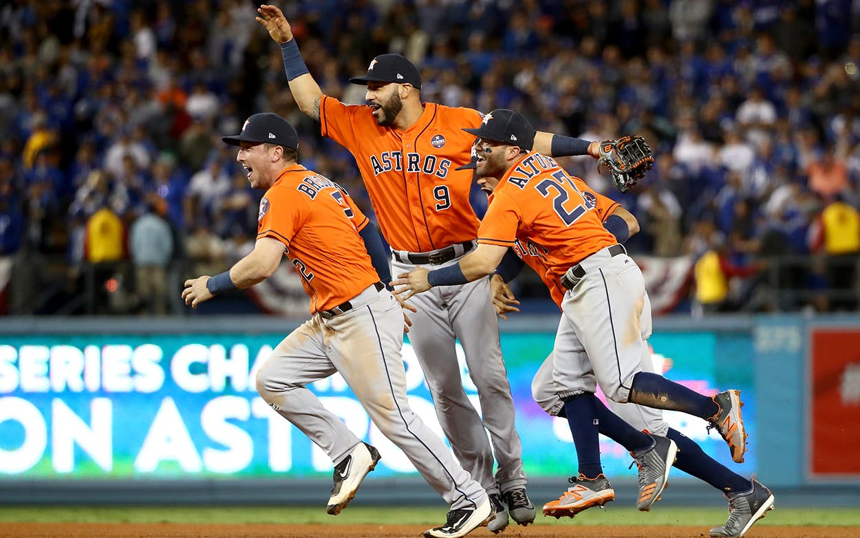 Alex Bregman #2, Marwin Gonzalez #9, Carlos Correa #1, and Jose Altuve #27 of the Houston Astros celebrate defeating the Los Angeles Dodgers 5-1 in game seven to win the 2017 World Series at Dodger Stadium on November 1, 2017 in Los Angeles, California.