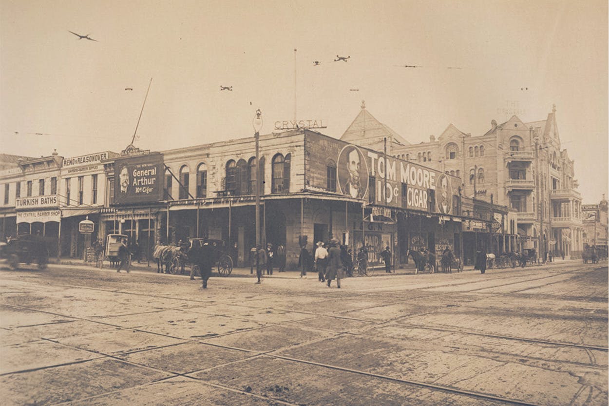 Historical photo of the intersection of Congress Avenue and Pecan Street in Austin, Texas.