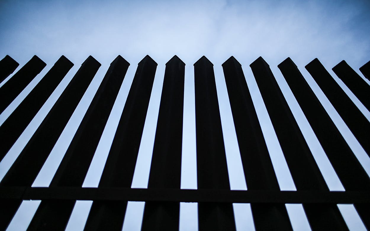 The U.S.-Mexico border fence stands on December 8, 2015 near McAllen.