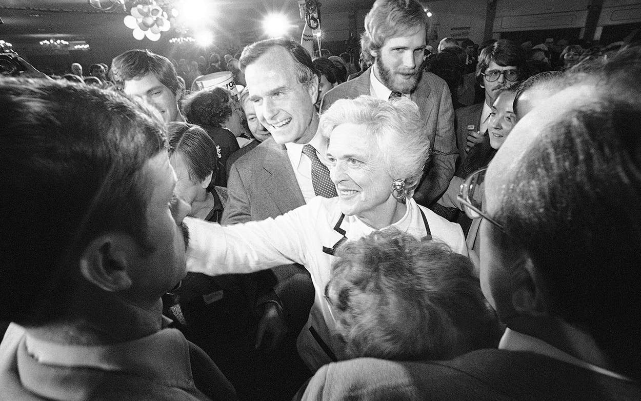George and Barbara Bush smile and shake hands with supporters after he spoke in Concord during the Republican presidential primary on Tuesday, Feb. 26, 1980.