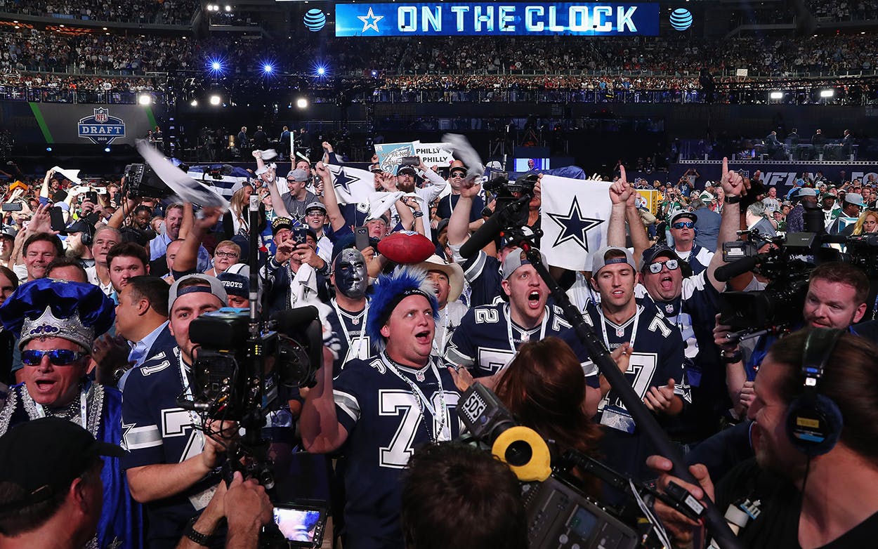 Dallas Cowboys fans cheer during the first round of the 2018 NFL Draft at AT&T Stadium on April 26, 2018 in Arlington.