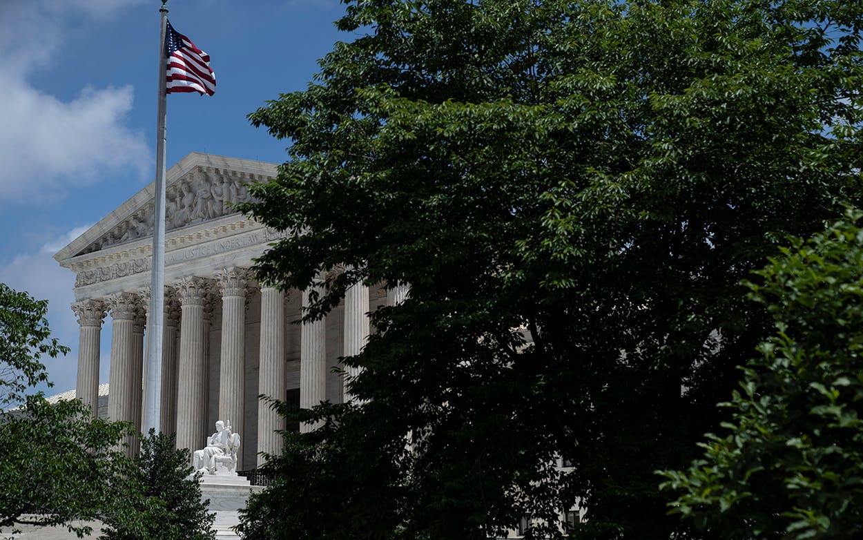 The U.S. Supreme Court is seen behind trees after it ruled that states may collect sales tax from retailers that do not have a physical presence, on June 21, 2018 in Washington, DC.