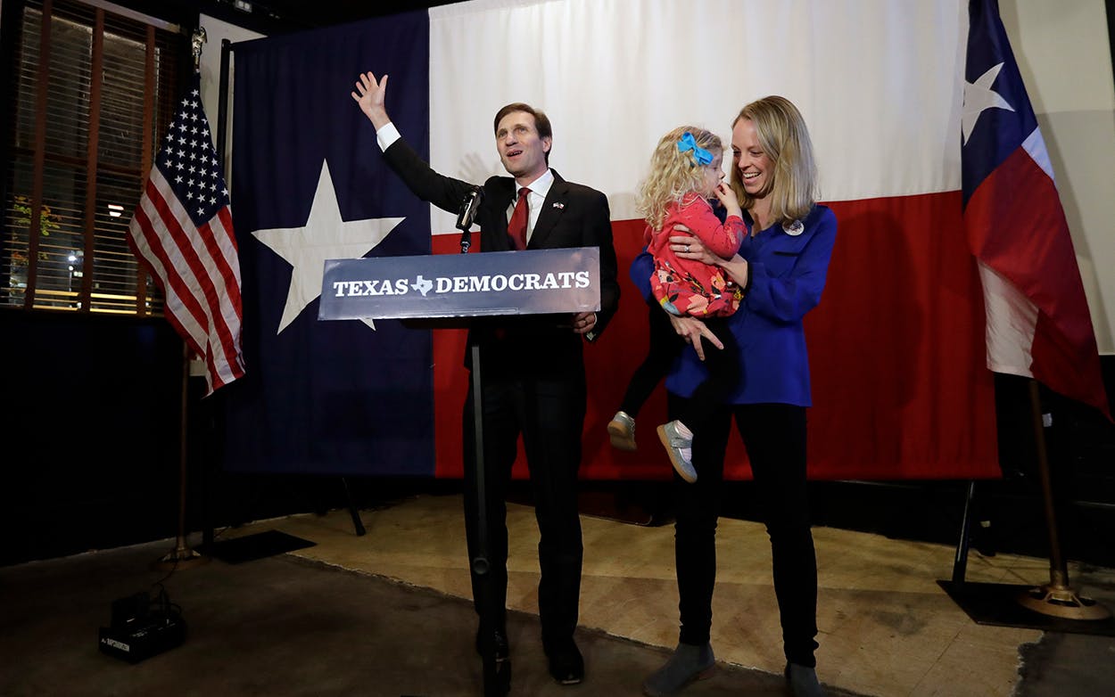 Democratic Texas Attorney General candidate Justin Nelson, left, with his wife Elizabeth and daughter Adeline talks to supporters during a Democratic watch party following the Texas primary election, Tuesday, March 6, 2018, in Austin.