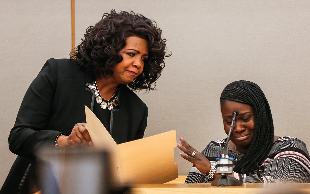 Charmaine Edwards reacts to an autopsy photo of her son Jordan Edwards shown by District Attorney Faith Johnson during a testimony on the first day of the trial in Dallas on Thursday, Aug. 16, 2018.