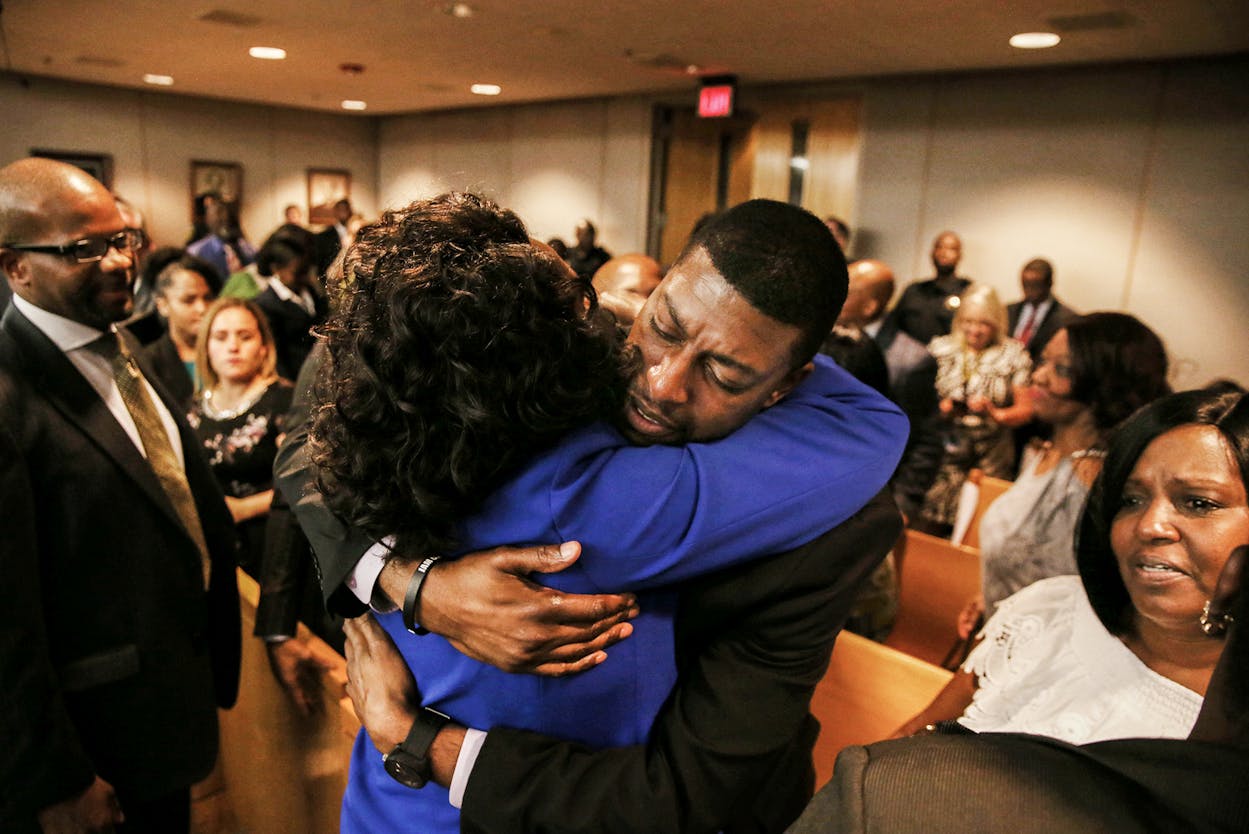 Odell Edwards, father of Jordan Edwards, gets a hug from Dallas County district attorney Faith Johnson after hearing a guilty of murder verdict during the ninth day of the trial of fired Balch Springs police officer Roy Oliver, who was charged with the murder of 15-year-old Jordan Edwards, in Dallas on Tuesday, Aug. 28, 2018.