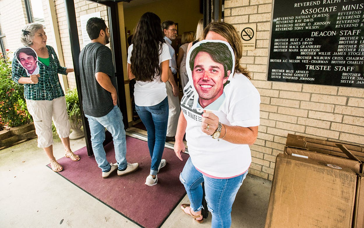 Campaign volunteers Geralyn Johnson of Bullard, left, and Rose Assad of Flint, right, hold paper cut-outs of the face of Beto O'Rourke, D-El Paso, at the doors of St. Louis Baptist Church in Tyler, where O'Rourke made a campaign stop to speak with voters on Monday Aug. 13, 2018.