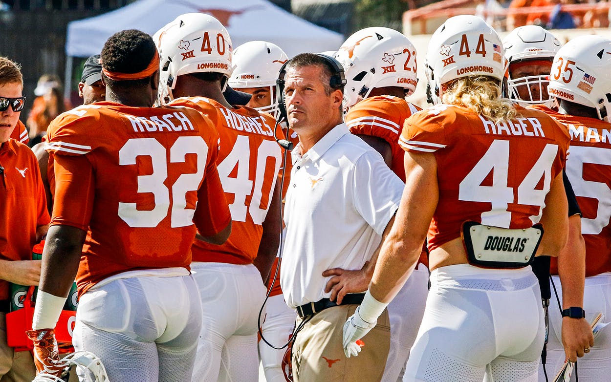 Texas defensive coordinator Todd Orlando briefs his players during the first half of an NCAA college football game against Oklahoma State, Saturday, Oct. 21, 2017, in Austin.