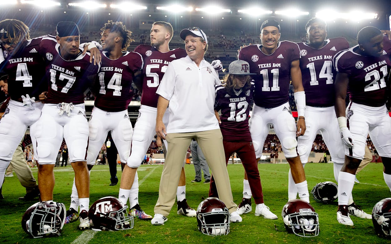 Texas A&M Aggies head coach Jimbo Fisher celebrates with his team after defeating the Northwestern State Demons in a football game at Kyle Field on August 30, 2018 in College Station.