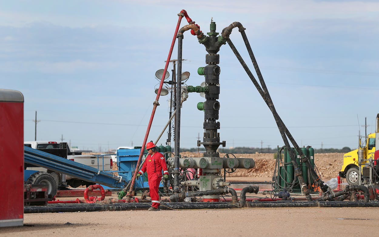 In a Monday, June 26, 2017 photo, a Halliburton wellhead is visible at a fracking site in Midland.