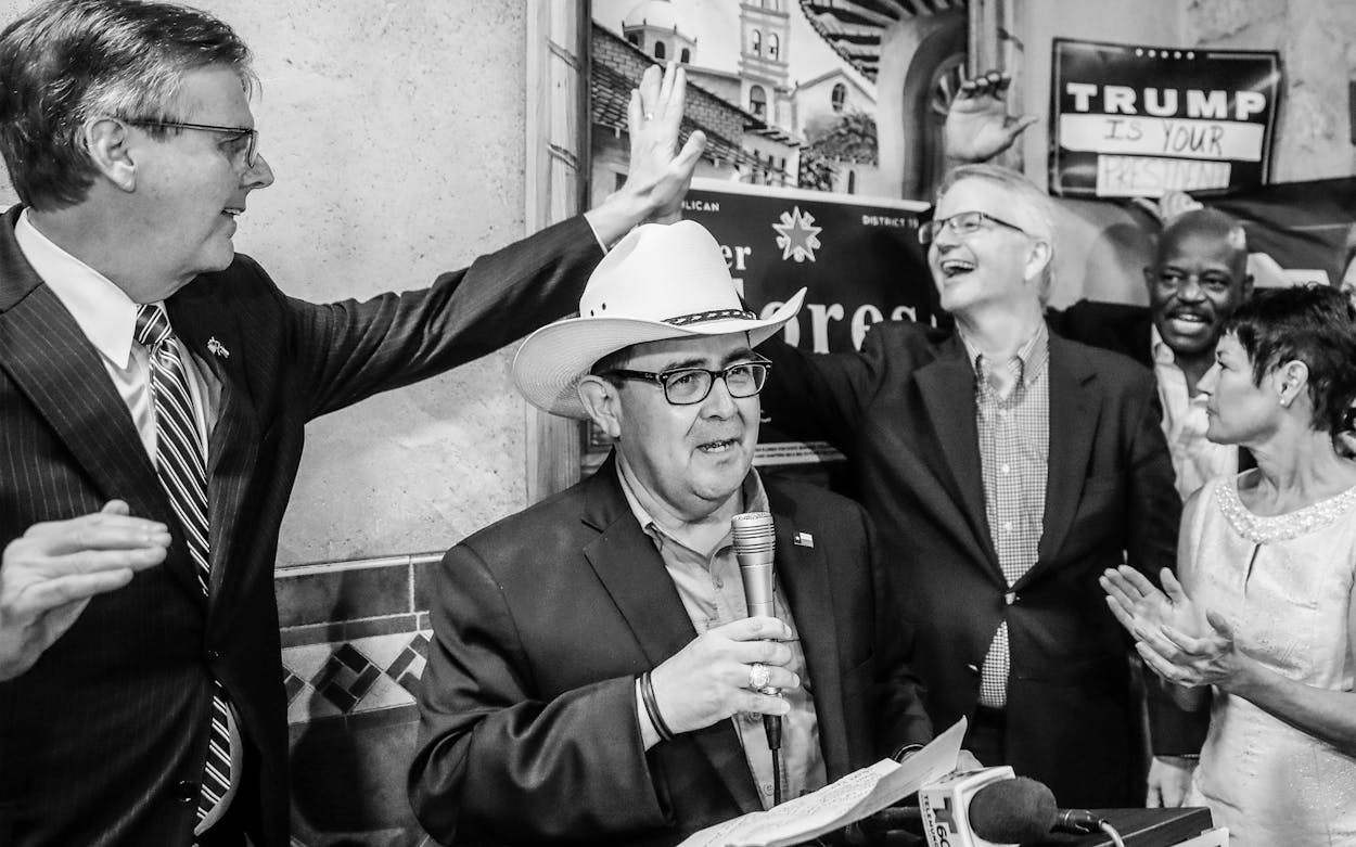 Republican Pete Flores, second from left, talks to supporters as Texas Lt. Gov. Dan Patrick, left, and Republican State Chairman James Dickey, second from right, high-five after Flores defeated Democrat Pete Gallego in a runoff election Sept. 18, 2018, in San Antonio.