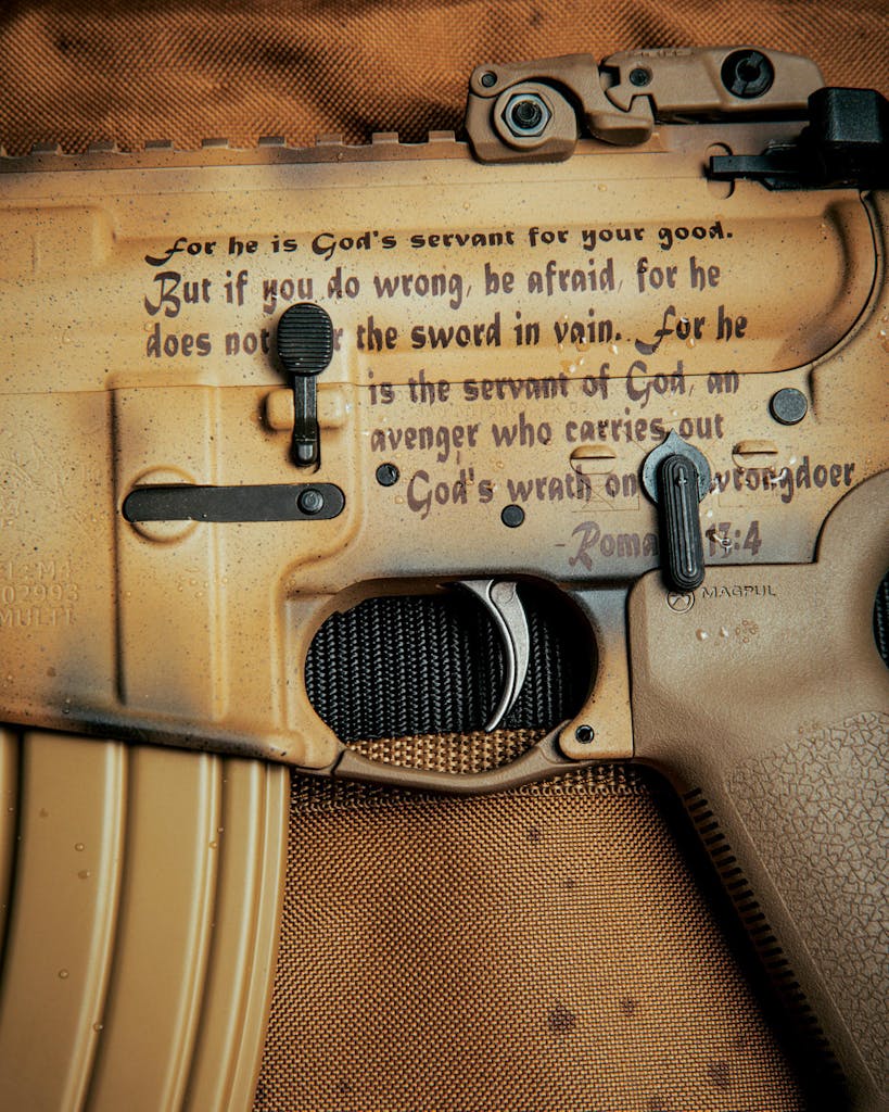 Close-up of the bible verse on Willeford's rifle, Romans 17:4. 