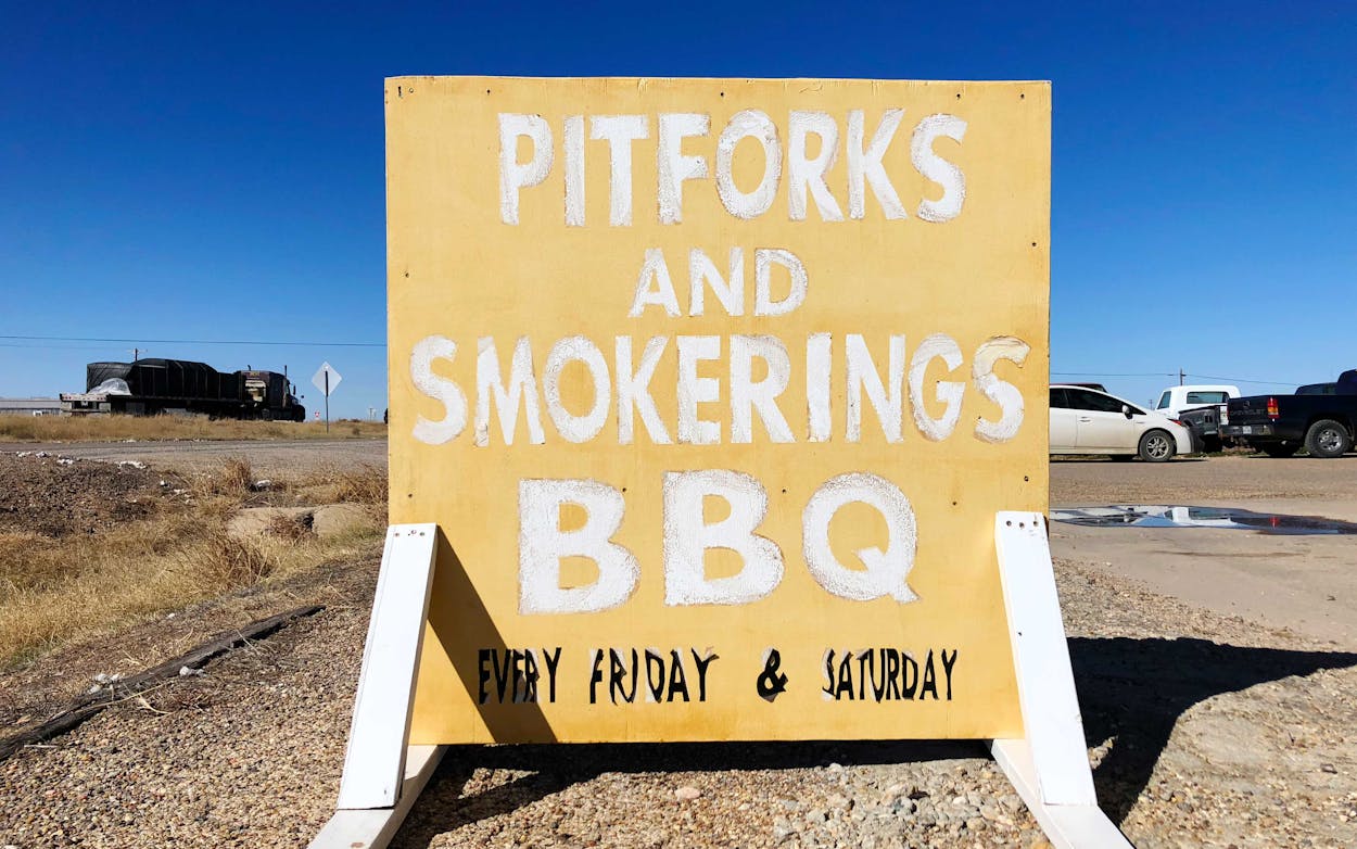 The sign for Pitforks and Smokerings BBQ along Highway 84