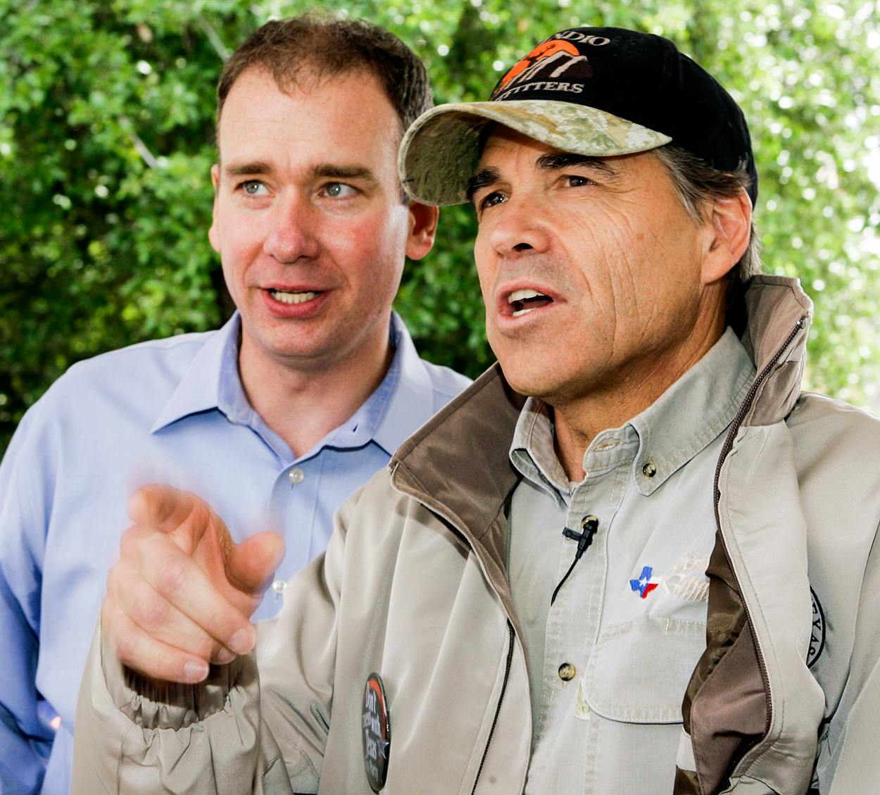 Gov. Rick Perry, right, talks with Michael Quinn Sullivan, left, before speaking during a "Don't Mess With Texas" tea party rally at City Hall Wednesday, April 15, 2009, in Austin.