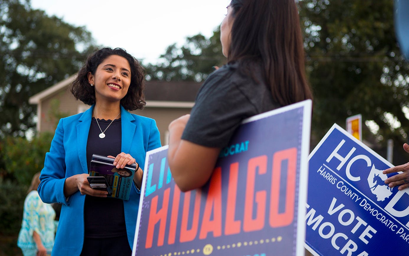 Democrat candidate for Harris County Judge, Lina Hidalgo, talks with campaign volunteers outside of a polling place located at the SPJST Lodge 88 in the Heights, Tuesday, Nov. 6, 2018 in Houston.