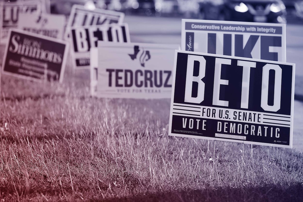 Campaign signs for Beto O'Rourke and Ted Cruz are crowded around the Carrollton Public Library on November 1, 2018 in Carrollton, Texas.