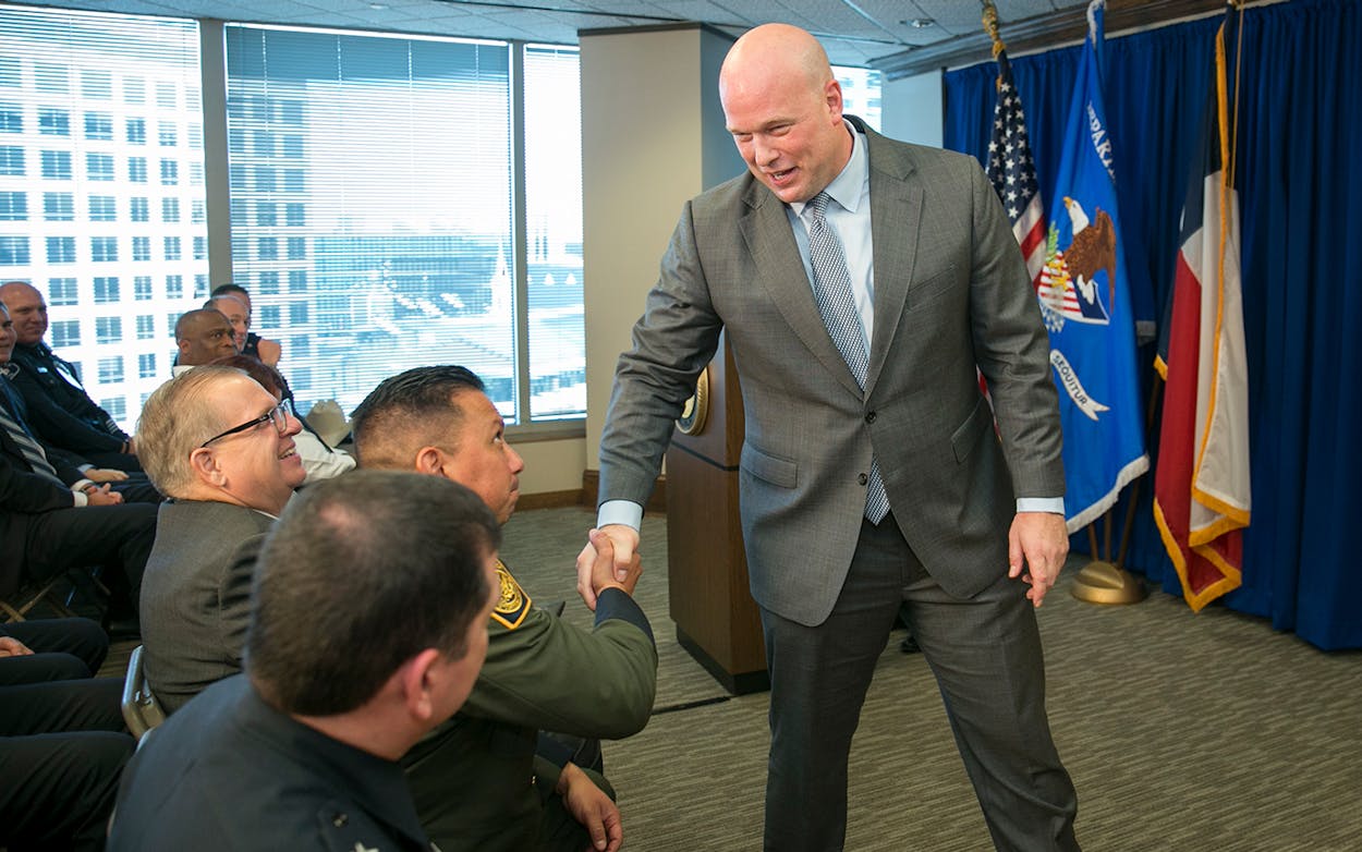 Acting U.S. Attorney General Matthew G. Whitaker shakes hands after speaking to area law enforcement officials at the U.S. Attorney's Office for the Western District of Texas in Austin, Tuesday, Dec. 11, 2018.