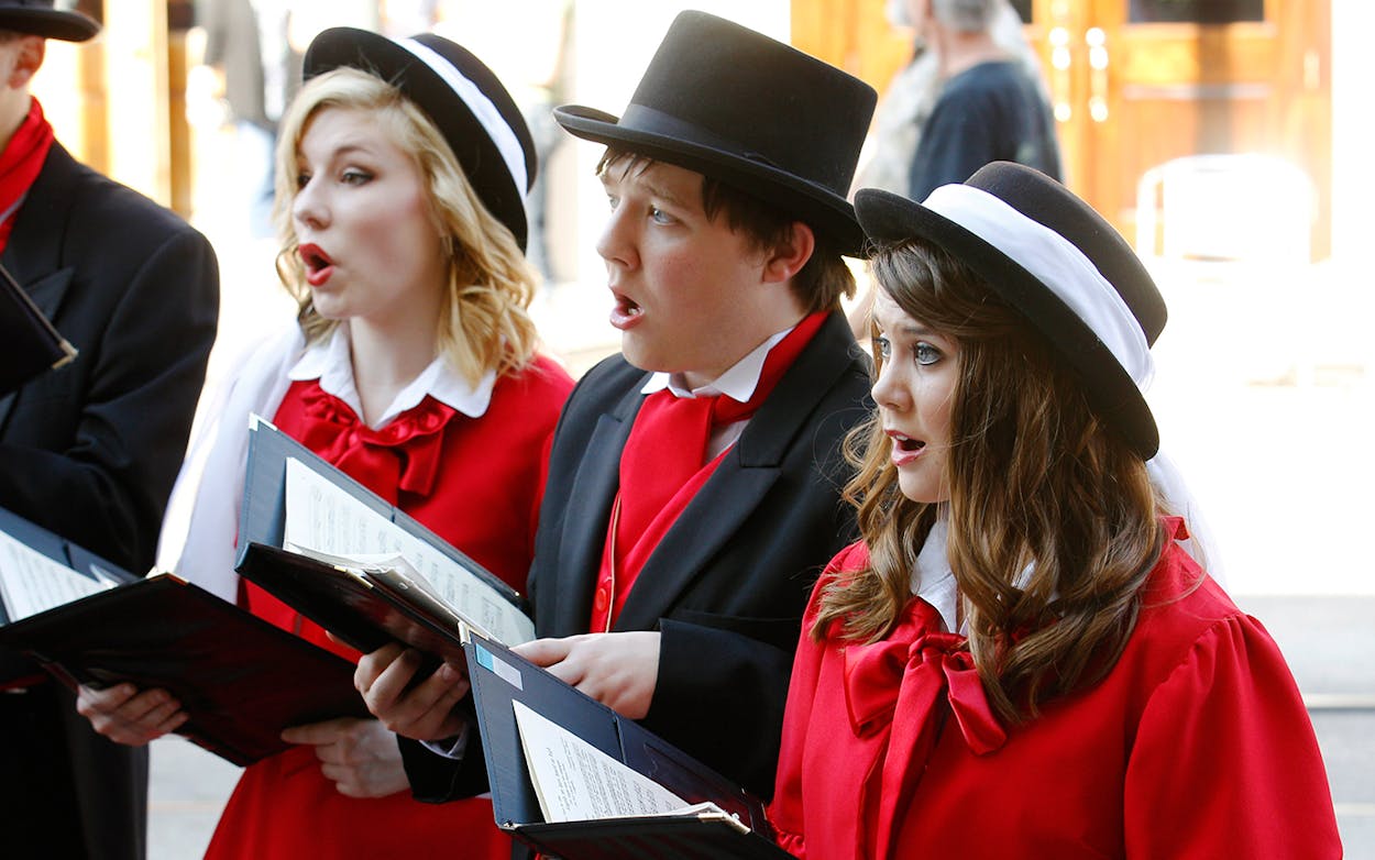 Members of the Belton High School Madrigal sing during the 39th annual Dickens on The Strand festival on December 1, 2012 in Galveston, Texas.