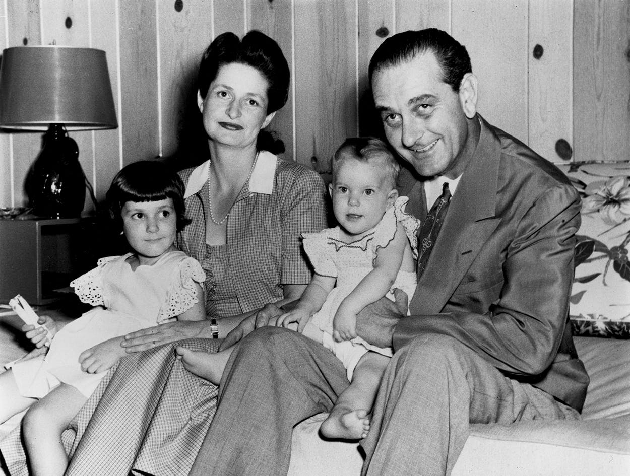 Ladybird and Lyndon B. Johnson sitting with their children. 