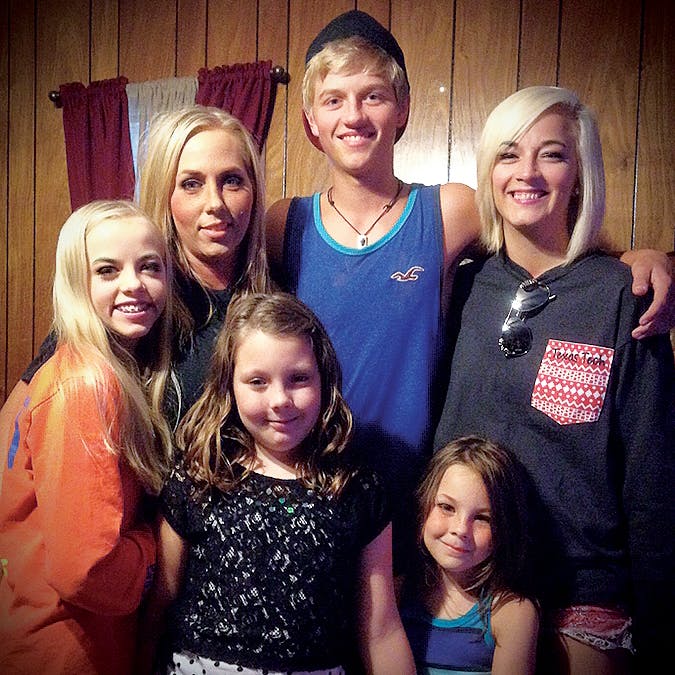 Jennifer Whittmore (second from left) with her children, Ashley, Sean, and Haile Beasley, and her stepdaughters Bailey and Tristyn (in front) on Mother’s Day in 2015.