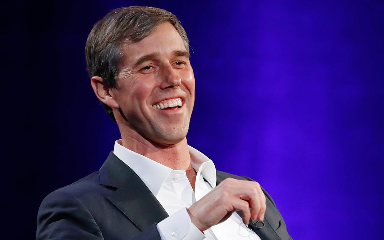 Former Democratic Texas congressman Beto O'Rourke laughs during a live interview with Oprah Winfrey in New York on Feb. 5, 2019.