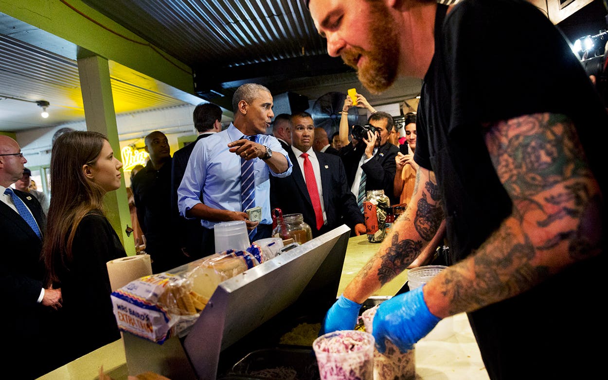 President Barack Obama orders barbecue during a surprise stop at Franklin Barbecue in Austin, Thursday, July 10, 2014.