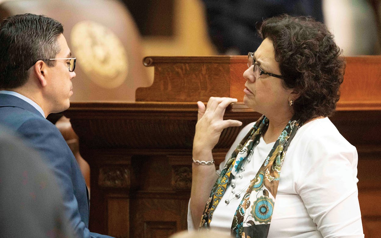 Celia Israel talking to Chris Paddie on the House floor in Austin on March 27, 2019.