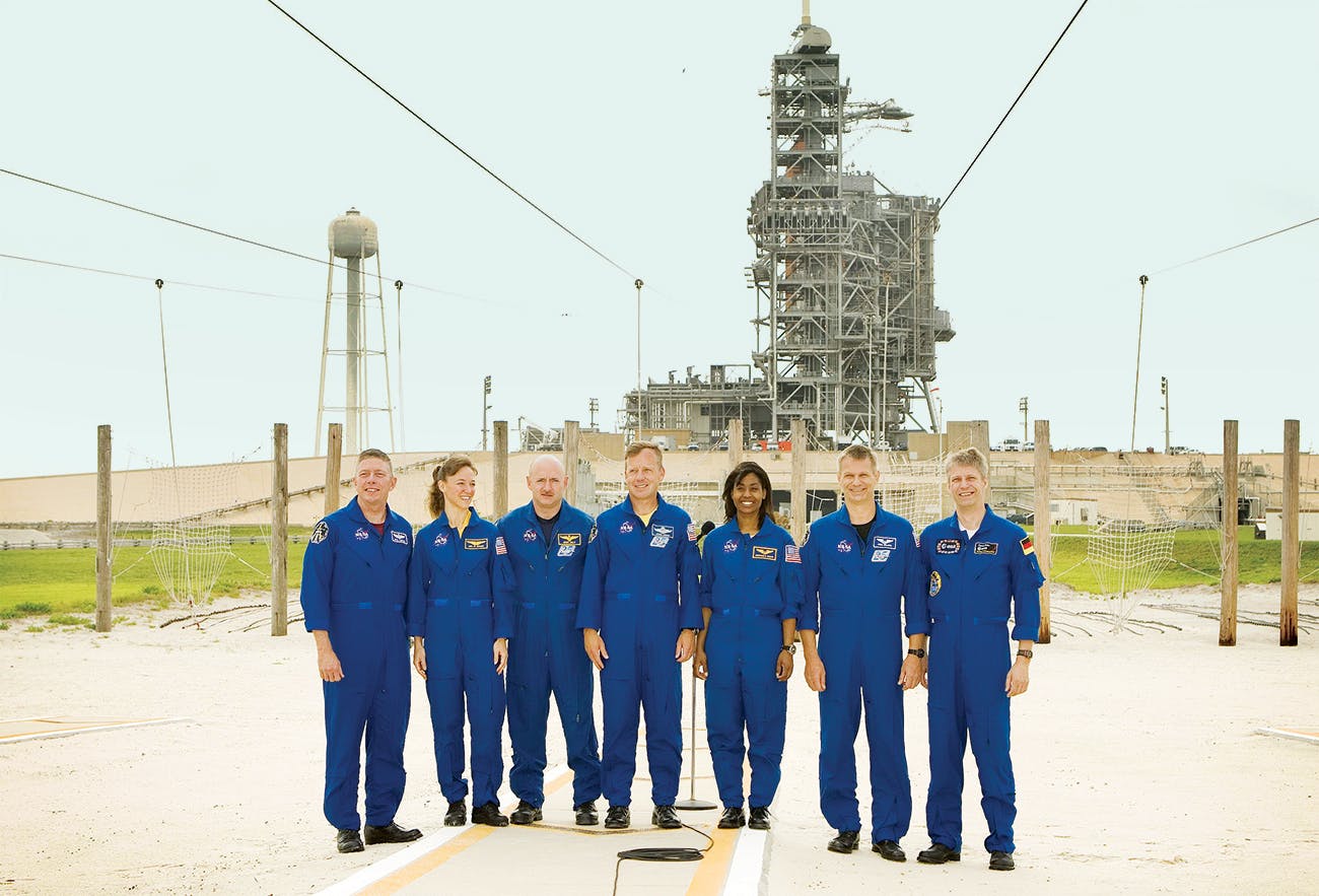 Nowak (second from left) with her Discovery crewmates at the Kennedy Space Center a few weeks before their launch date.