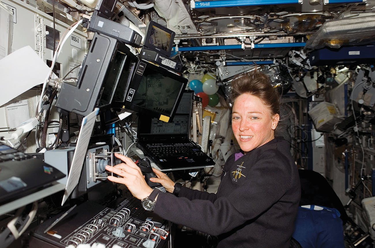 Nowak at work in the International Space Station on July 12, 2006, during her time in orbit as part of the space shuttle Discovery crew.