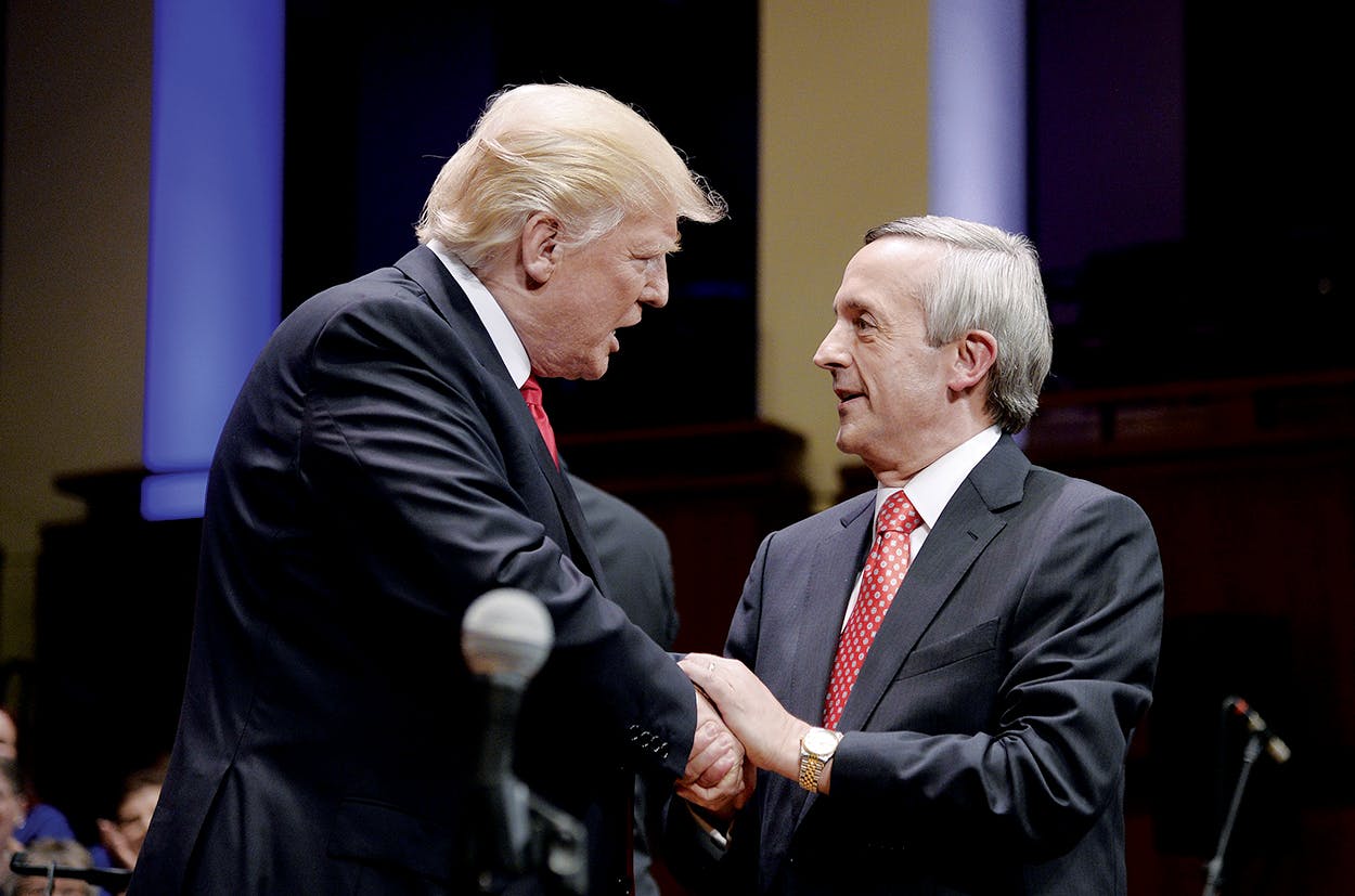 Donald Trump and Jeffress shaking hands. 
