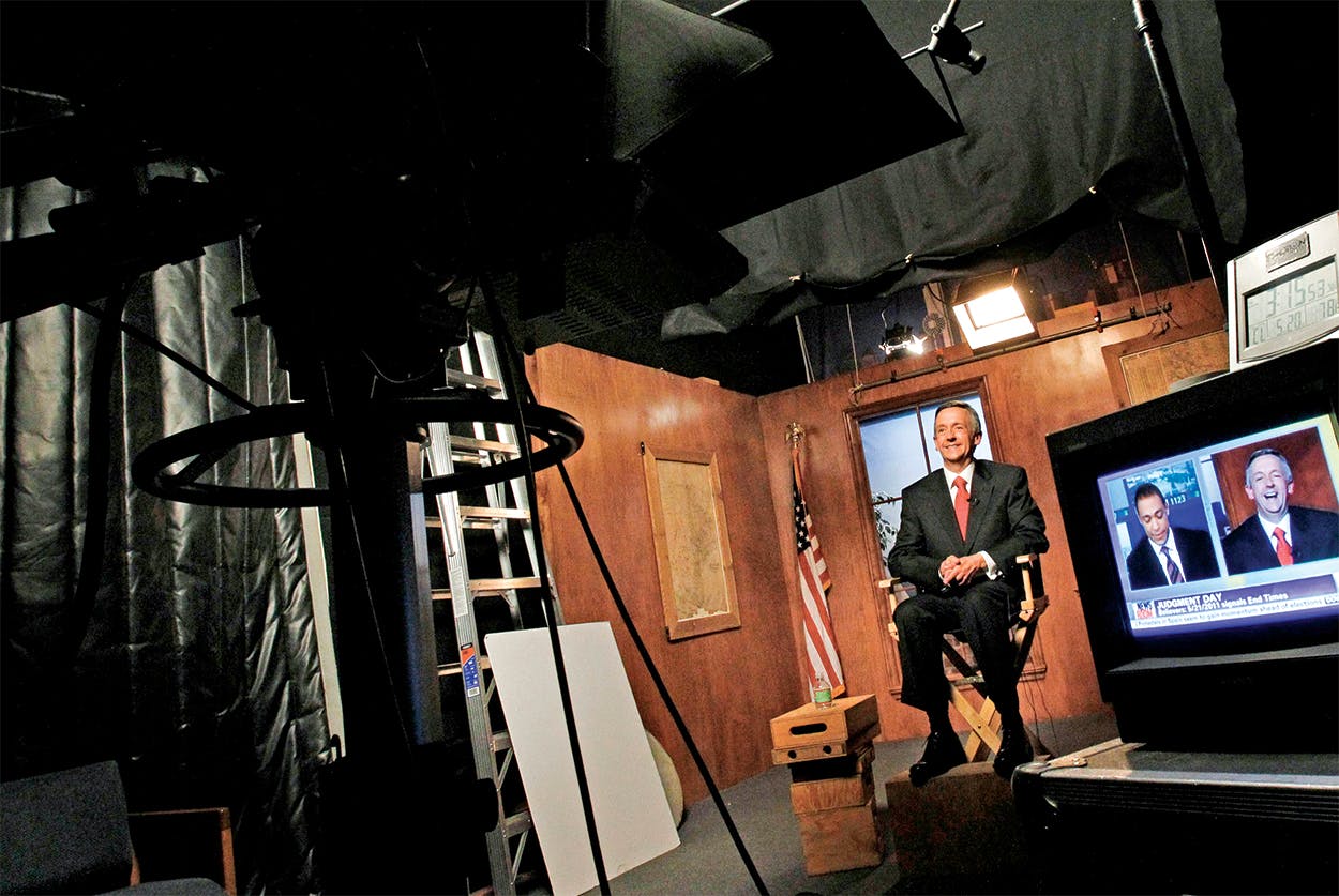 Robert Jeffress sitting in an interview chair in front of a camera and small TV. 