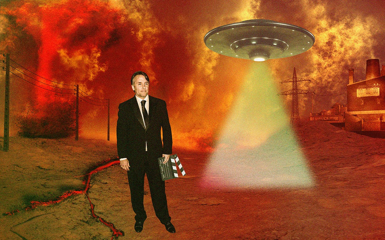Richard Linklater standing in a futuristic nightmare landscape while a UFO flies in the background.