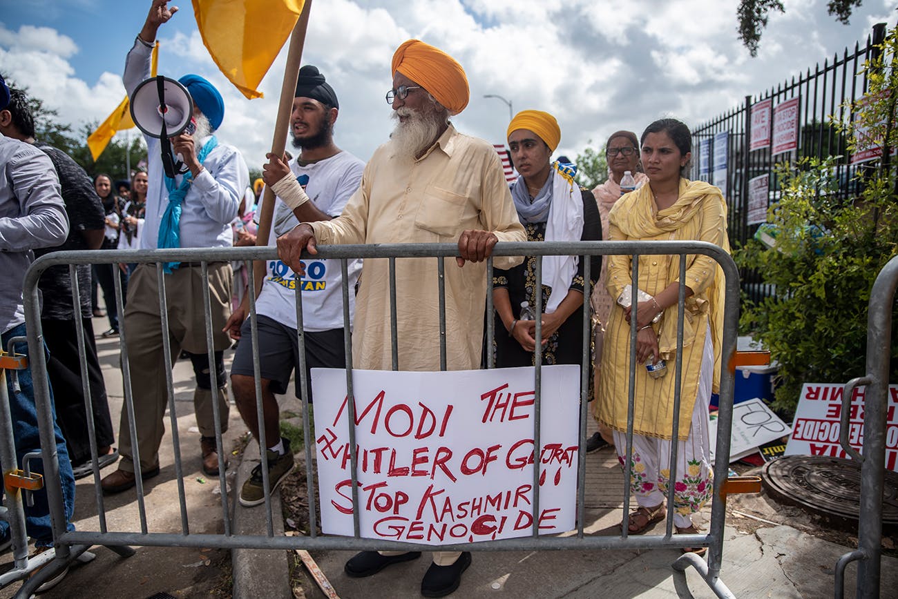 Protesters chant and wave flags outside after a rally attended by Indian Prime Minister Narendra Modi at NRG Stadium on September 22, 2019 in Houston.