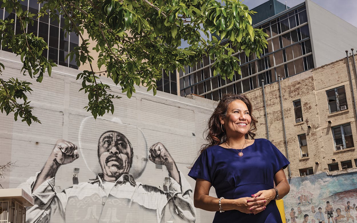 Escobar in front of a mural by artist El Mac in downtown El Paso on April 6, 2019.