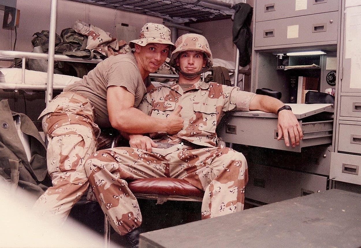 Tony Buzbee poses and makes a face at the camera in uniform with Ryan Coglin. 