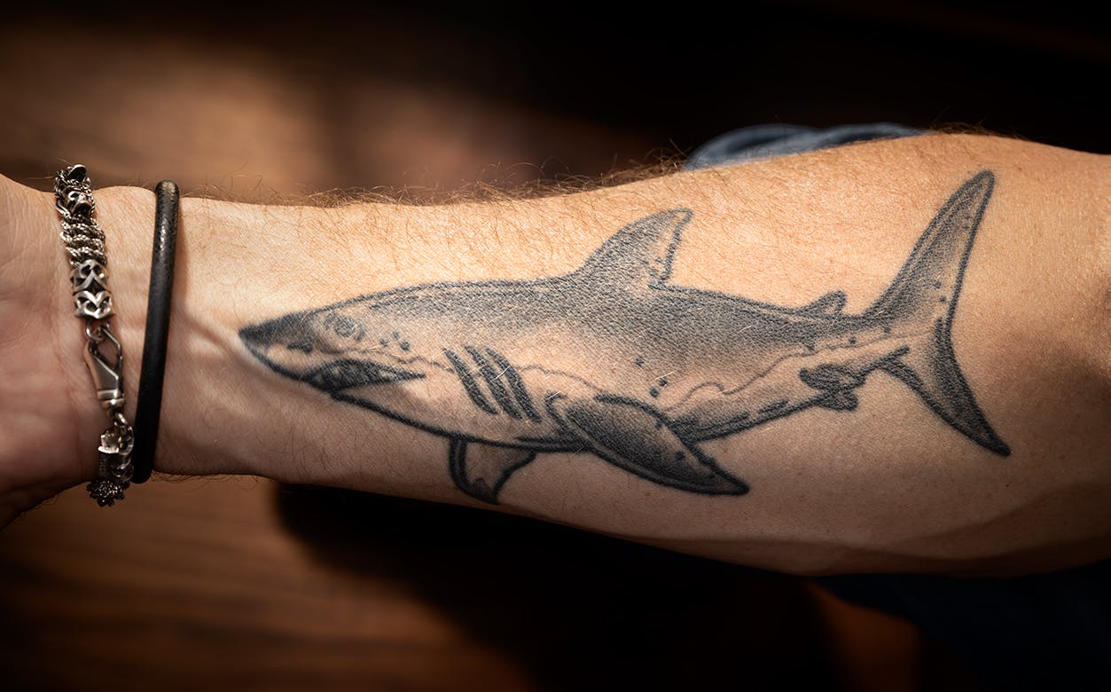 Detail of Buzbee's shark tattoo