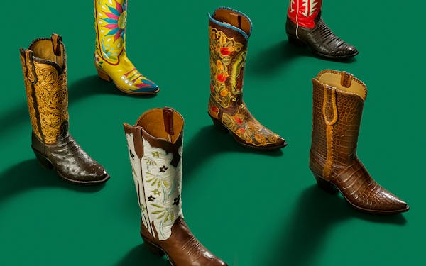 Five single cowboy boots against a green background.