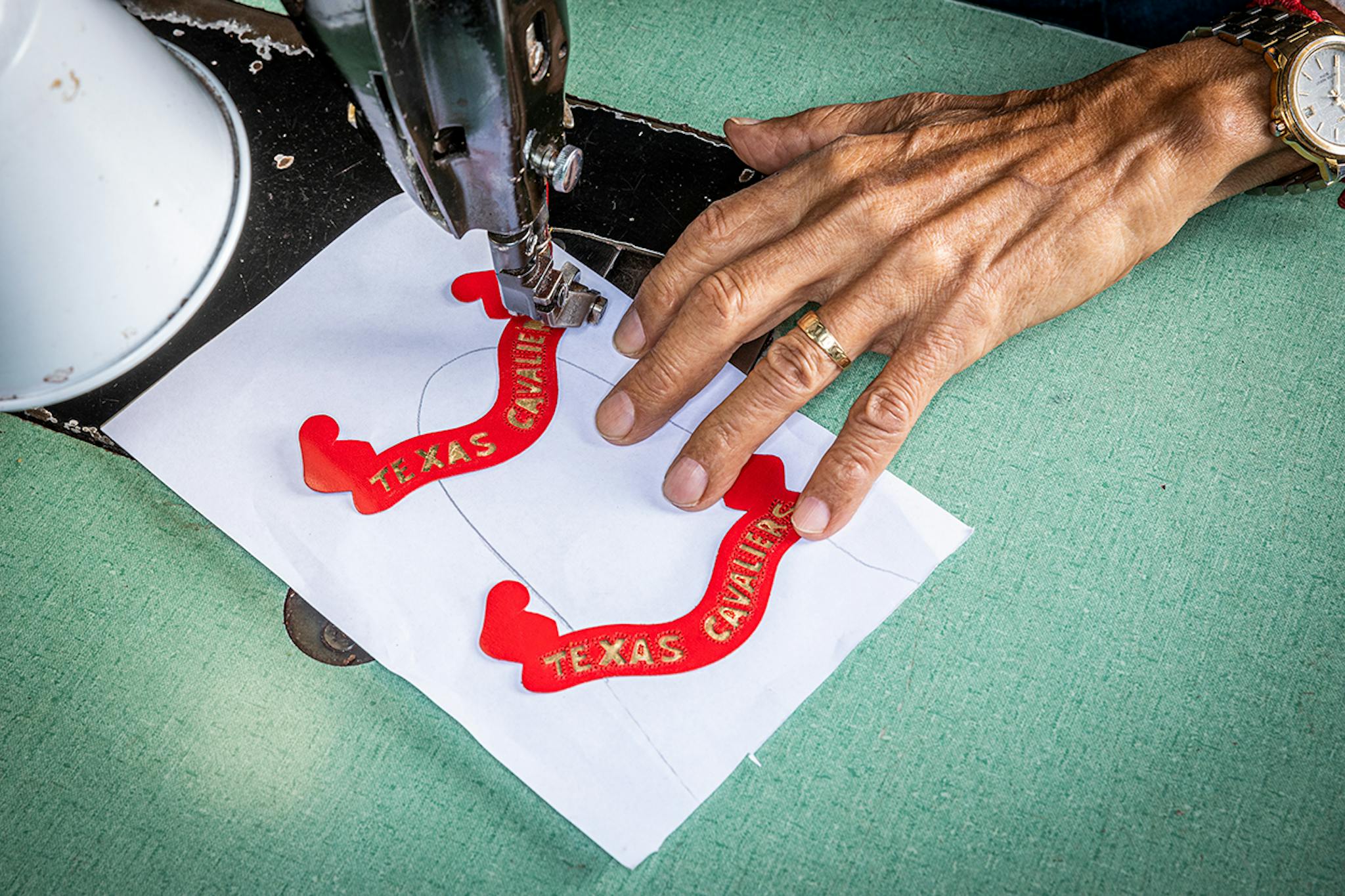 Ortiz works on the fine stitching required for a boot’s ornamental inlays.