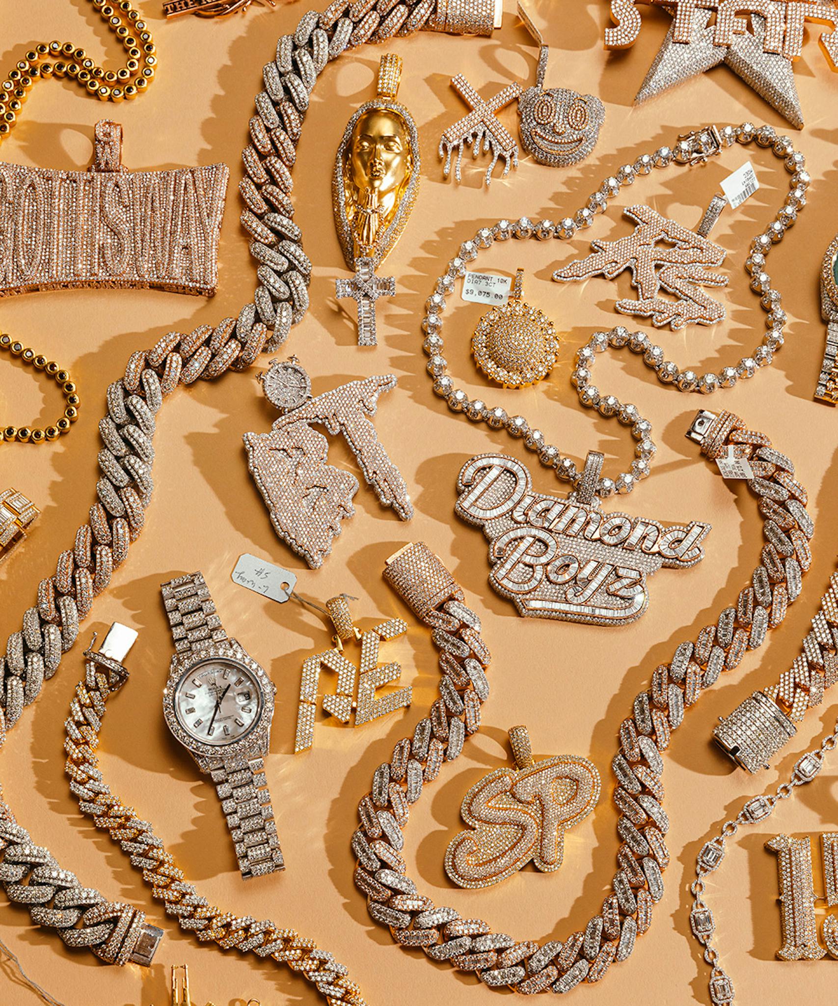 Johnny Dang chains, pieces, and watches from a showroom, including his Diamond Boys chain.